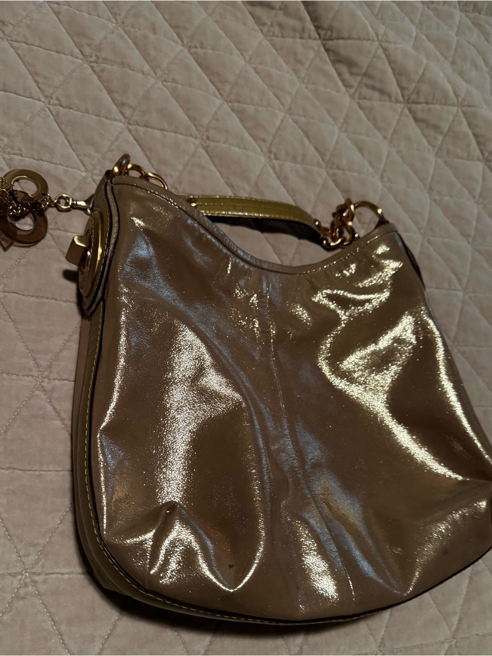 Coach Payton hobo purse with rose gold accents.
